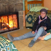 Marion enjoying the fire of our room of Cabañas Diaz in Areponamichic